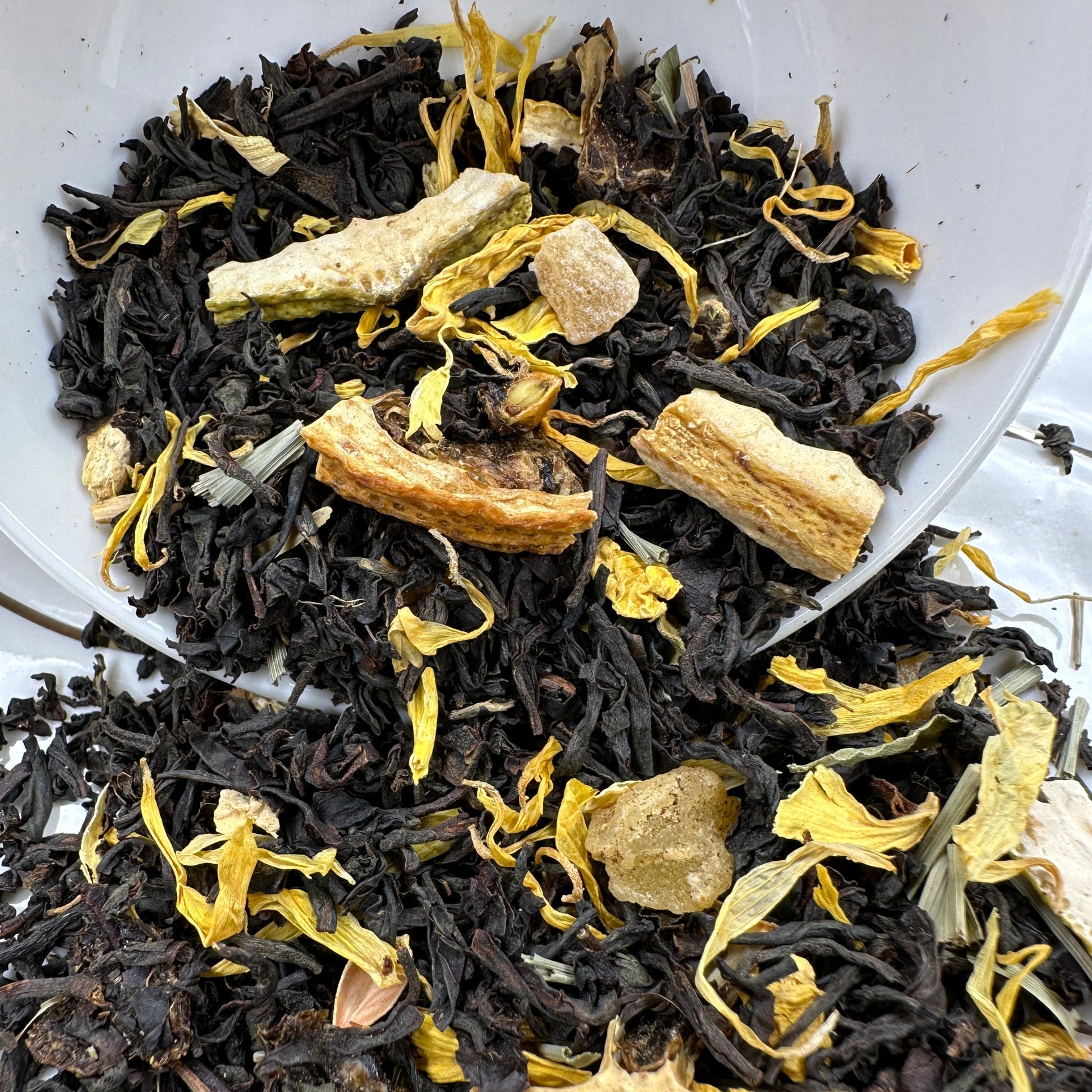 Lemon Ginger, flavored black loose leaf tea spilling